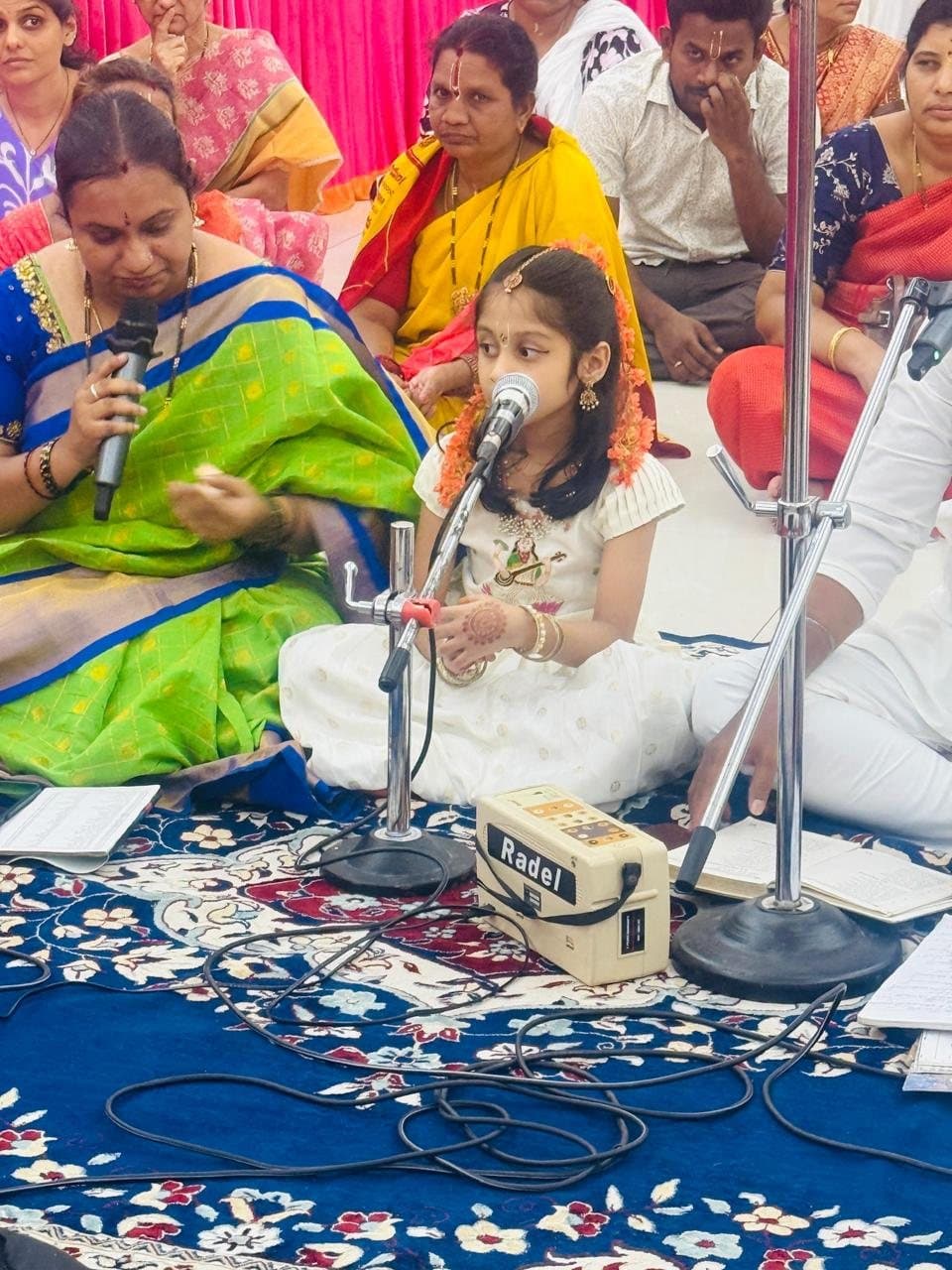 A young student singing at the mic